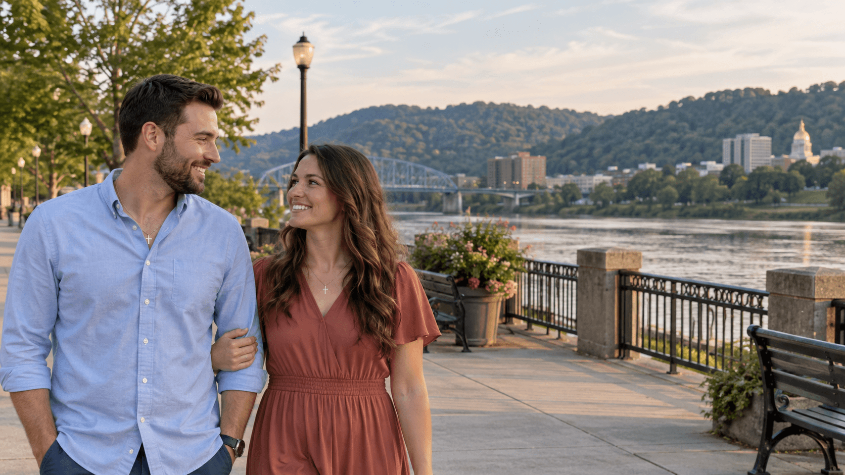 Christian couple beside the Kanawha River in a Haddad Riverfront Park-inspired setting.