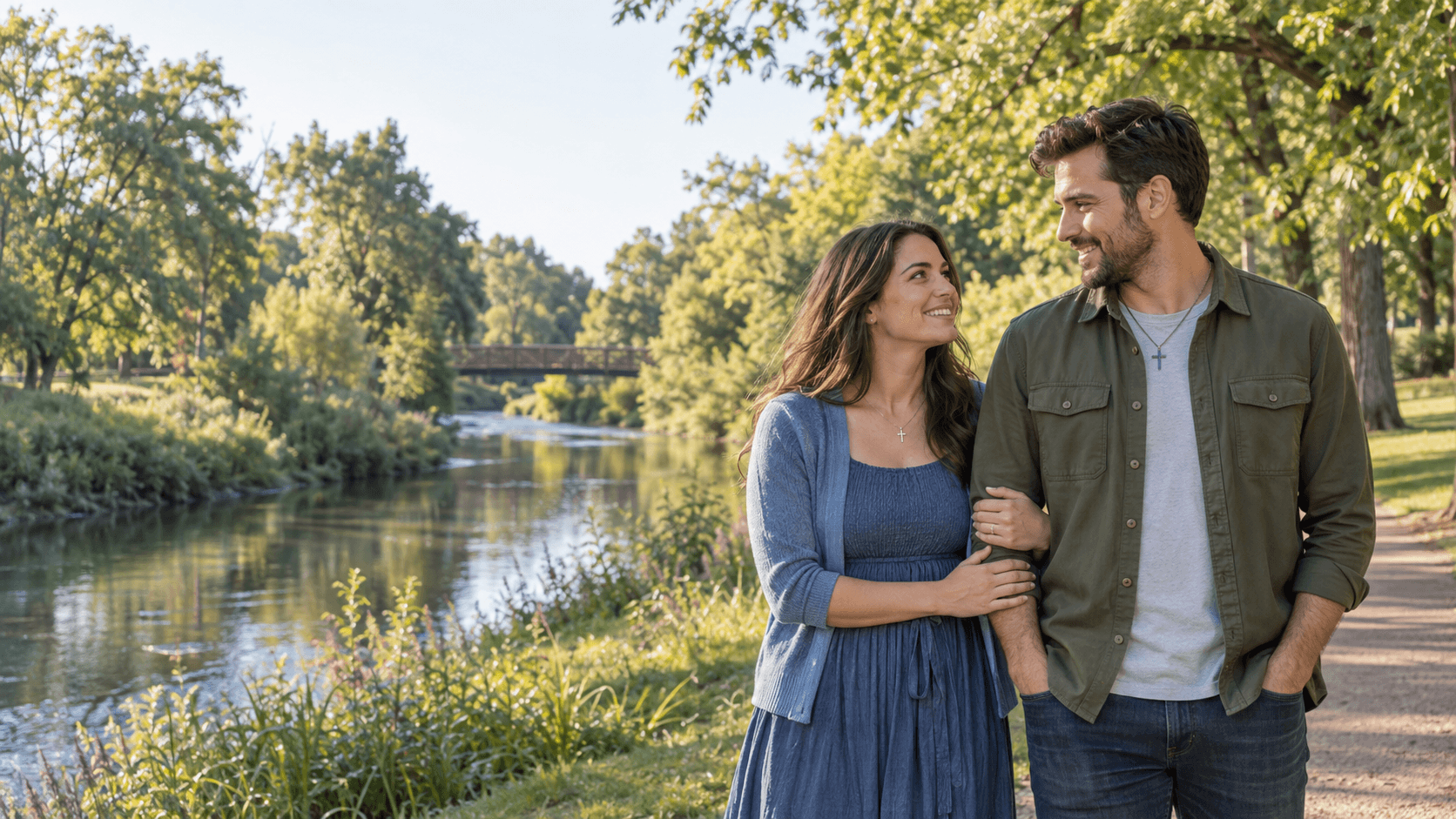 Couple wearing cross necklaces on a leafy Alton Baker Park-inspired path in Eugene.