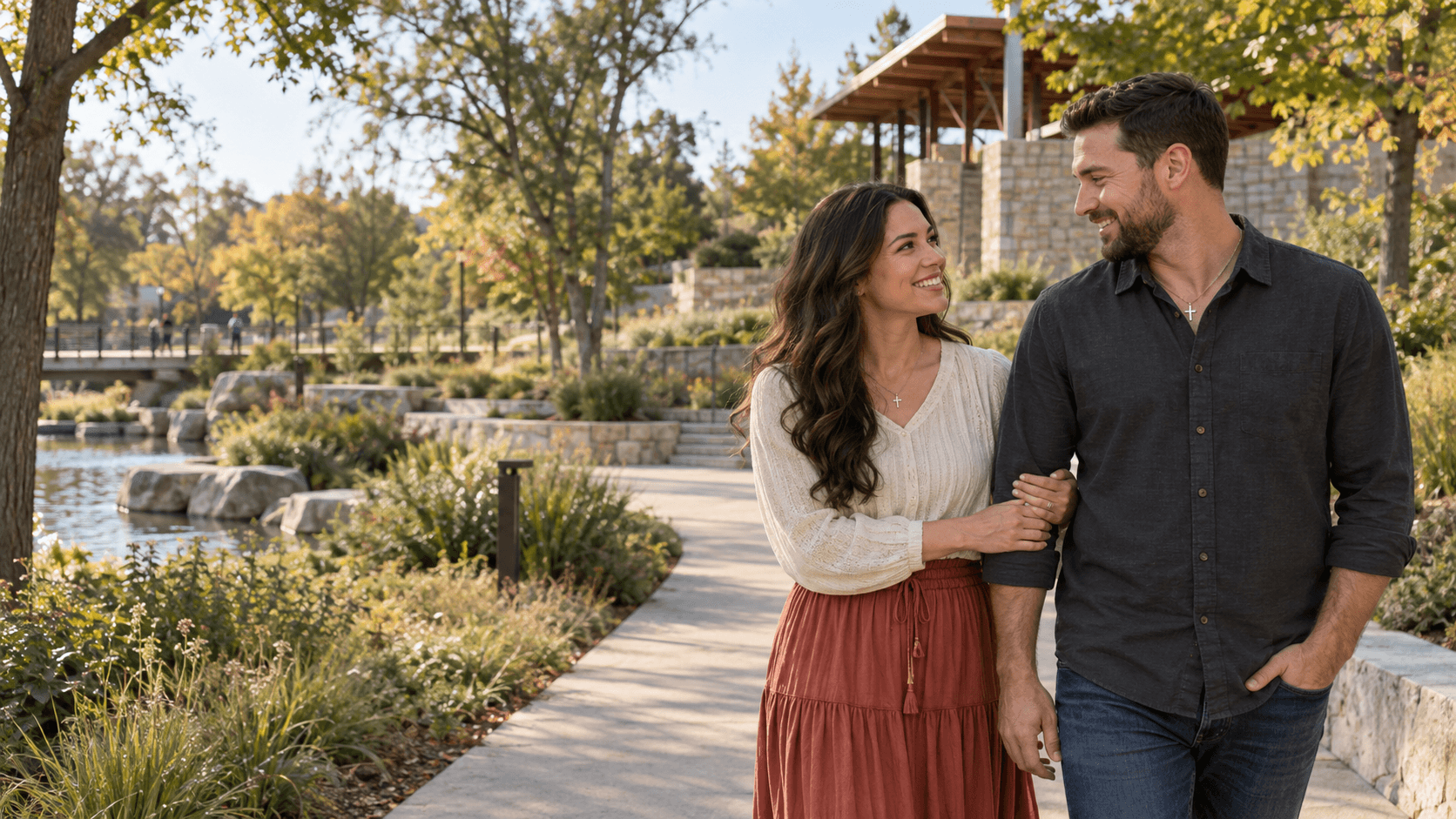 Christian couple on a landscaped path in a Gathering Place-inspired setting in Tulsa.