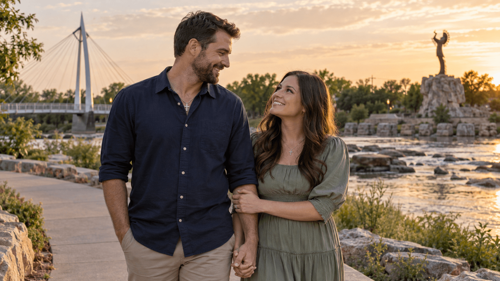 Couple wearing cross necklaces beside a Wichita-inspired Arkansas River setting.